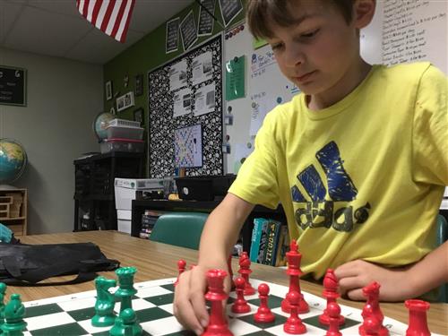 Child playing Chess